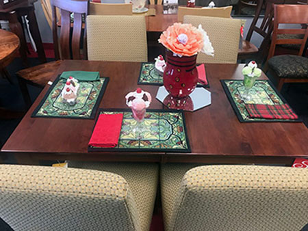 Wood amish table with cloth chairs